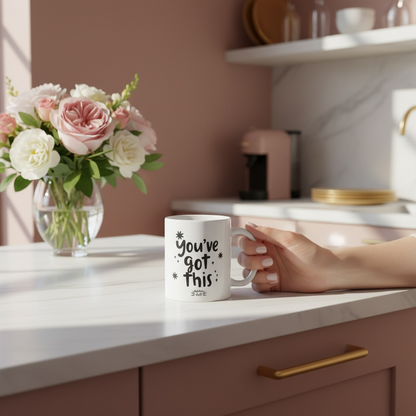 Dabble Doll gift box featuring a coffee mug with the phrase You've Got This and a floral arrangement