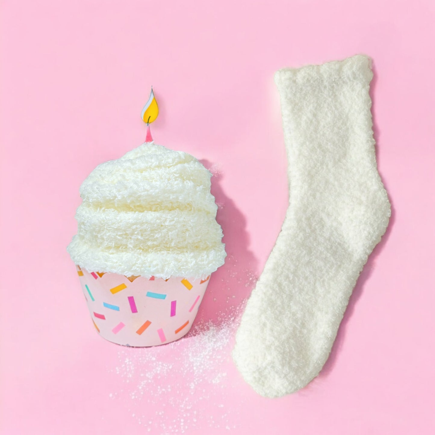 Dabble Doll Gift Box featuring cupcake socks beside a colorful cupcake and sprinkles