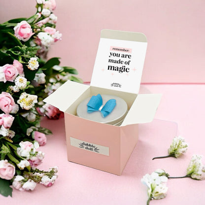 Dabble Doll Affirmation Jar in pastel pink with a blue bow, perfect for girls and women to inspire positivity