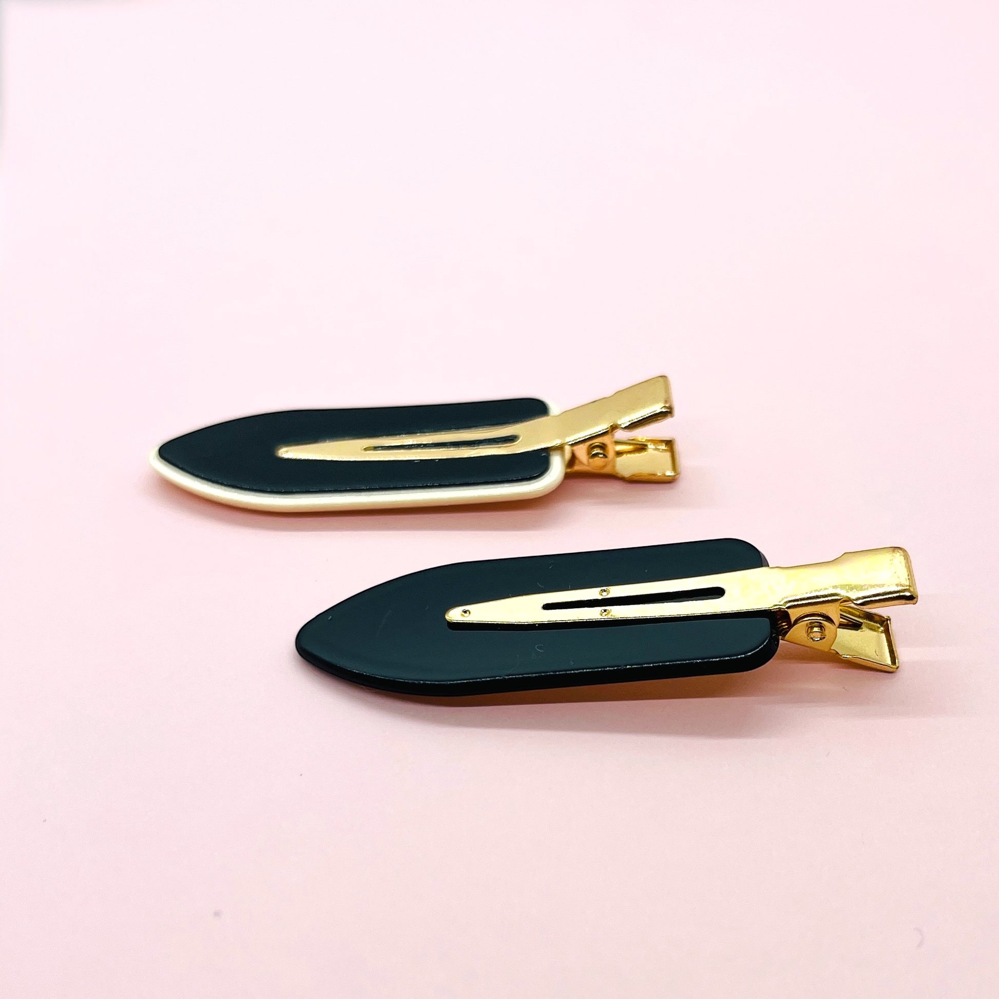 Dabble Doll black and gold hair clips included in a badass gift box for women