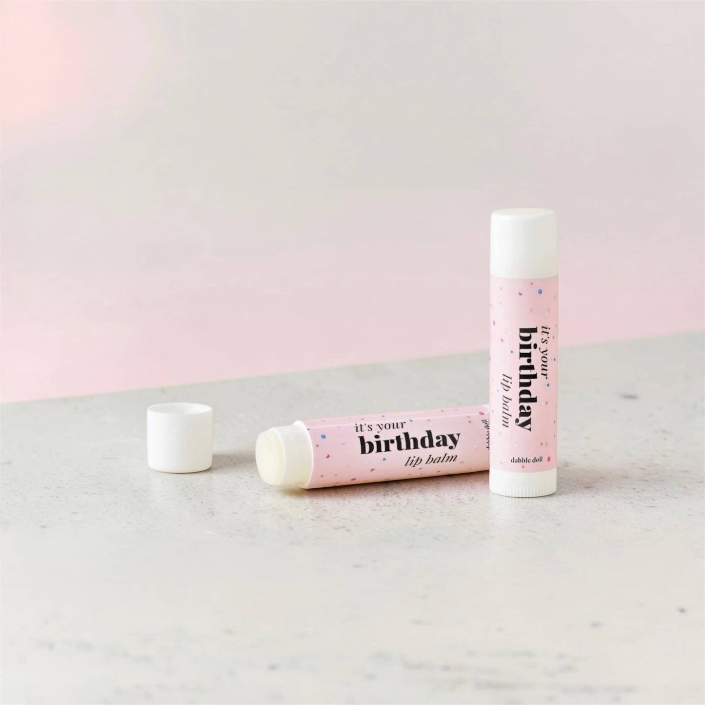 Dabble Doll It's Your Birthday Lip Balm in Pink Packaging for Birthday Celebrations