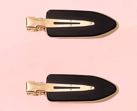 Dabble Doll black no bend hair clips with gold metal backing on pink background