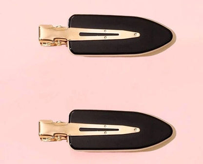Dabble Doll black no bend hair clips with gold metal backing on pink background