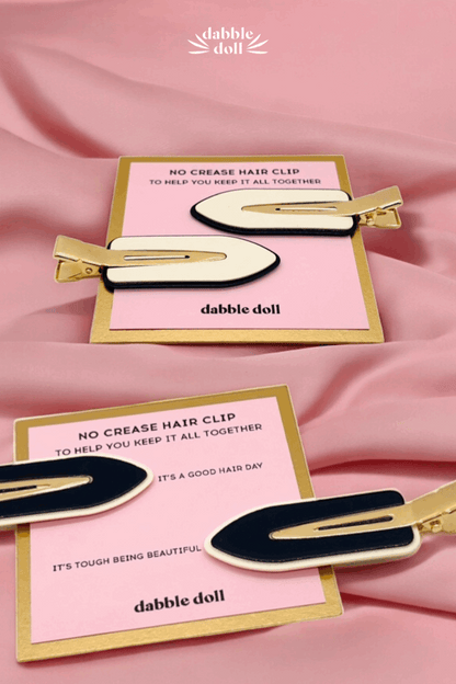 Dabble Doll No Crease Hair Clip on a pink card in a box with gift for stylish hair solutions