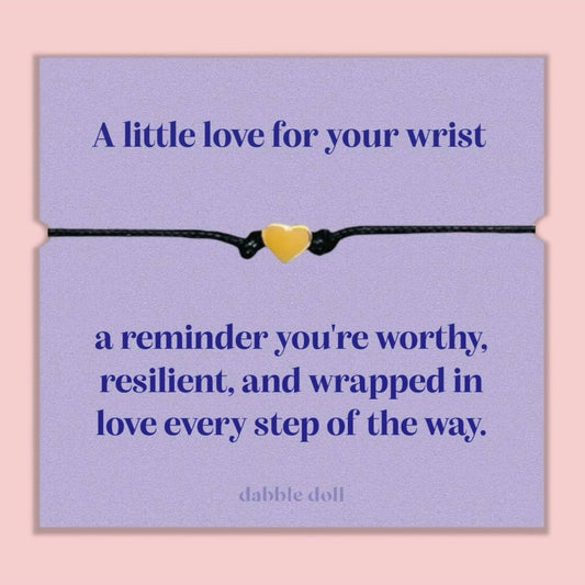 Dabble Doll bracelet chrome heart on a purple card with an inspiring message about worthiness and love