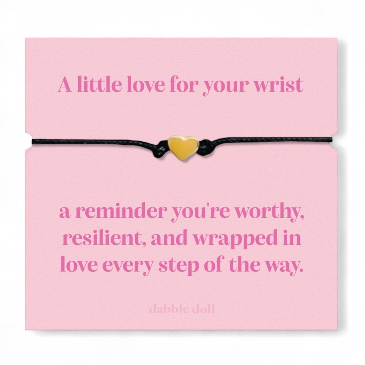 Dabble Doll bracelet chrome heart on a pink card with an inspirational message about self-worth