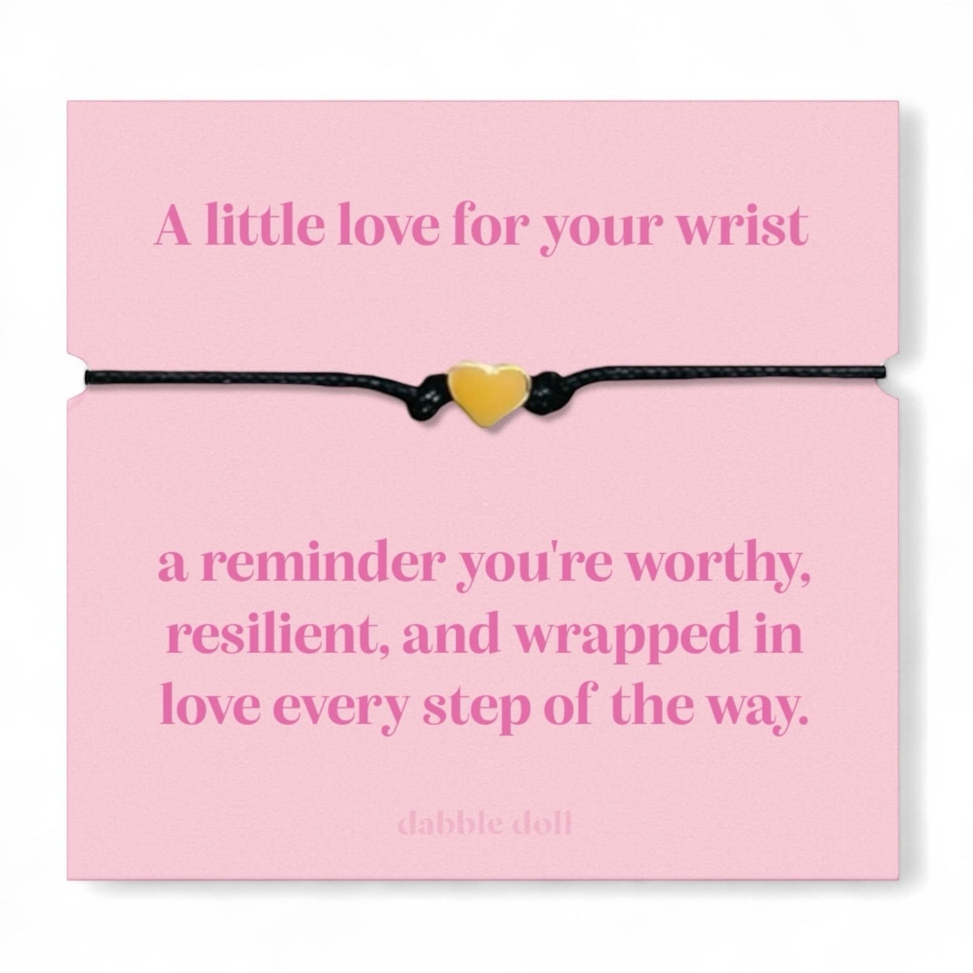 Dabble Doll bracelet chrome heart on a pink card with an inspirational message about self-worth