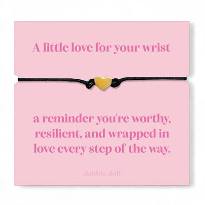 Dabble Doll bracelet chrome heart on a pink card with an inspirational message about self-worth