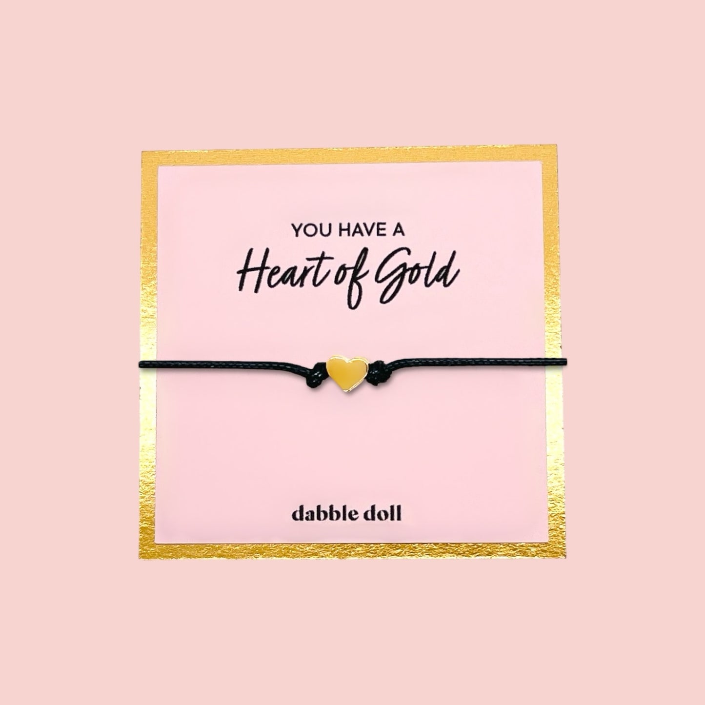 Dabble Doll black cord bracelet with yellow heart charm, perfect for girls and women