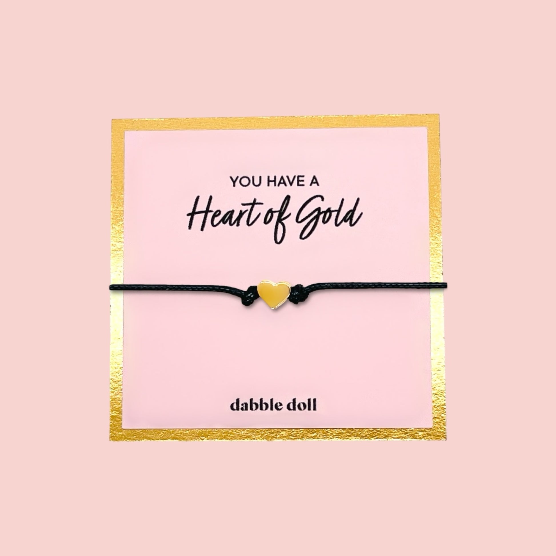 Dabble Doll black cord bracelet with yellow heart charm, perfect for girls and women