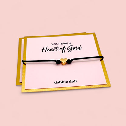 Dabble Doll Heart of Gold Bracelet in Black cord with a gold heart charm for girls and women