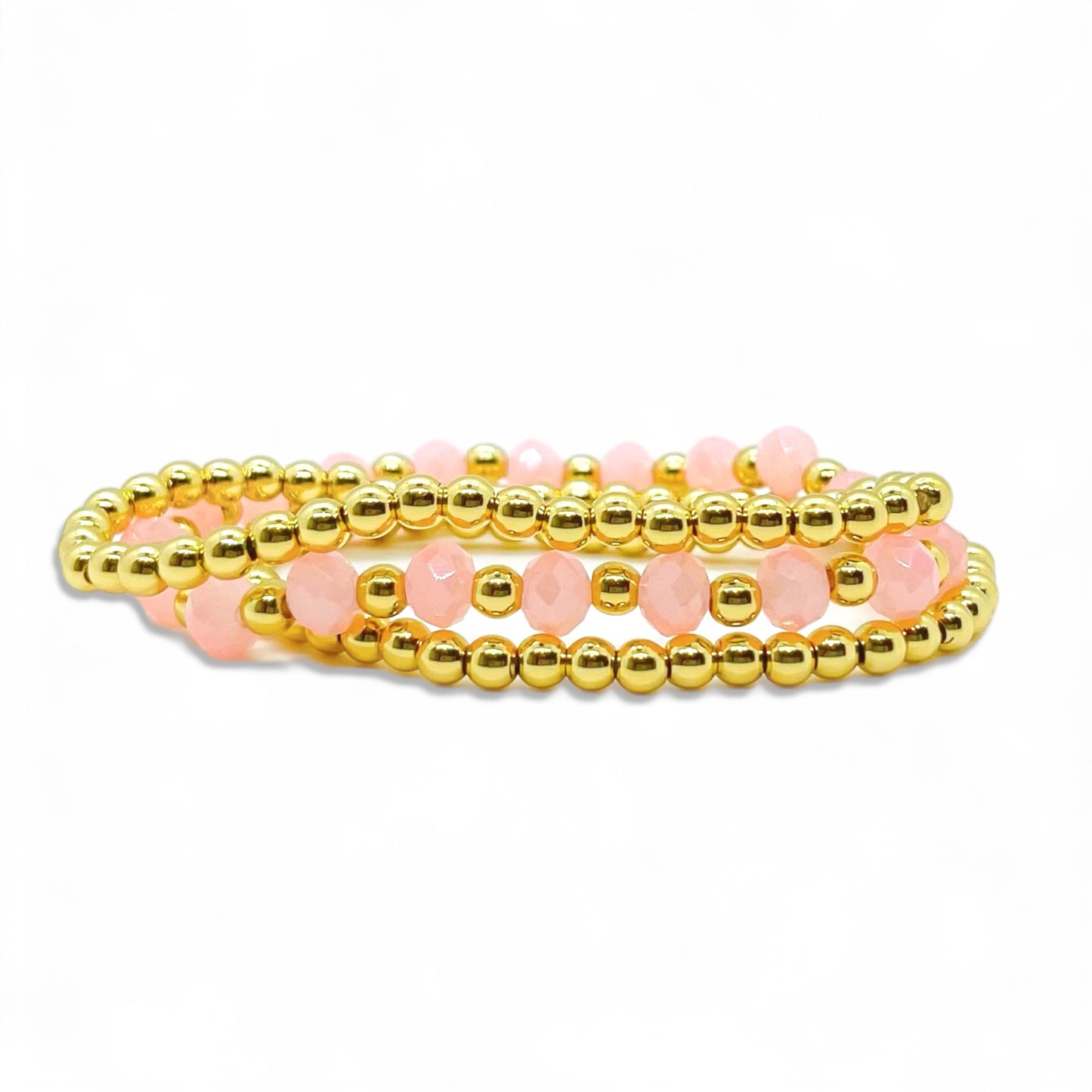 Pink and gold bracelet stack made for girls and women with shimmering beads and stylish design