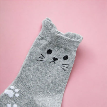 Gray cat socks with cute face and paw print detail from Dabble Doll cat socks gift box
