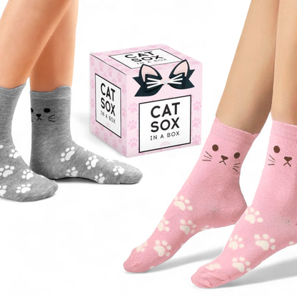 Dabble Doll cat socks gift box with pink and gray cat face socks featuring paw prints