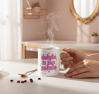 Dabble Doll Ceramic Mug with the phrase 'delulu is the solulu', perfect for gift boxes or coffee lovers