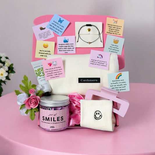 Dabble Doll cheer up care package women gift box with cozy socks, smile jar, bracelet, lotion, and positive notes