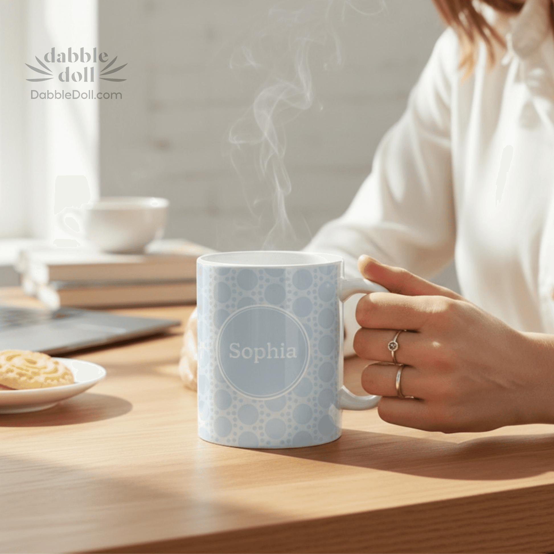 Gift box featuring a personalized coffee ceramic mug with a light blue design and a name label