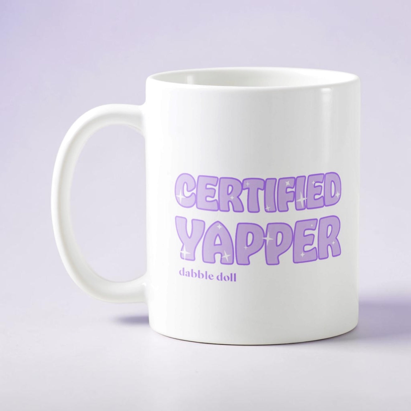 White Dabble Doll coffee mug novelty with 'Certified Yapper' text in purple font