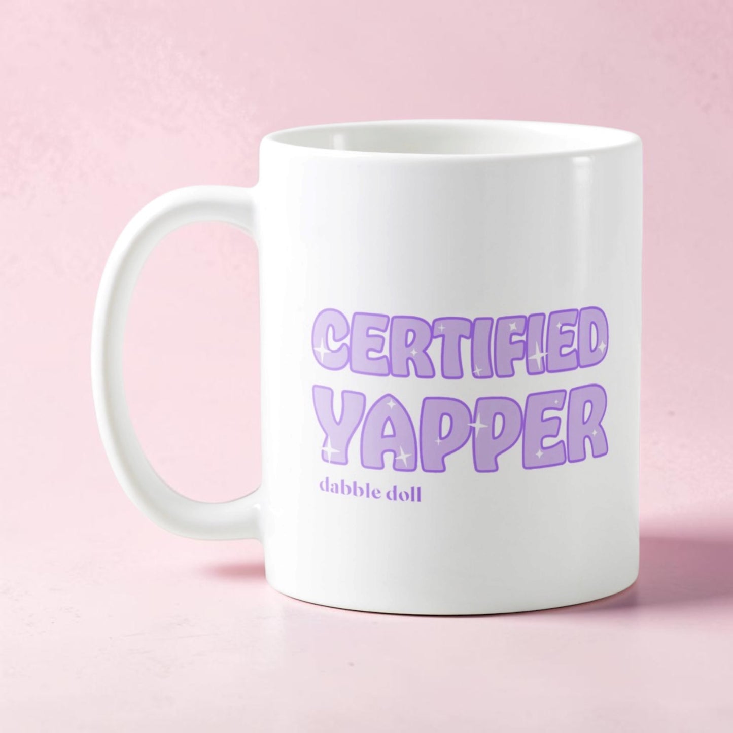Dabble Doll Certified Yapper Coffee Mug Novelty with Playful Purple Text on a White Background