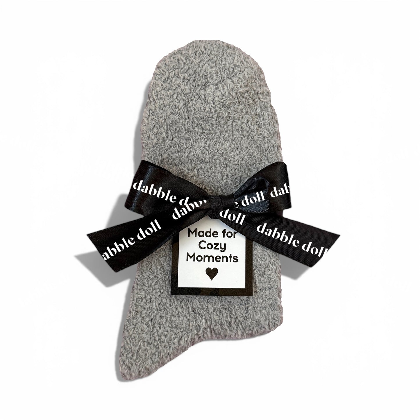 Dabble Doll Gift Box featuring cozy socks for women wrapped with a stylish black bow
