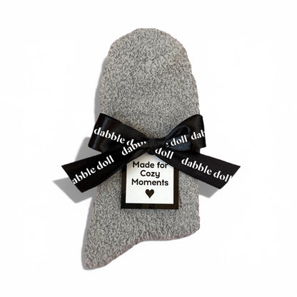 Dabble Doll Gift Box featuring cozy socks for women wrapped with a stylish black bow