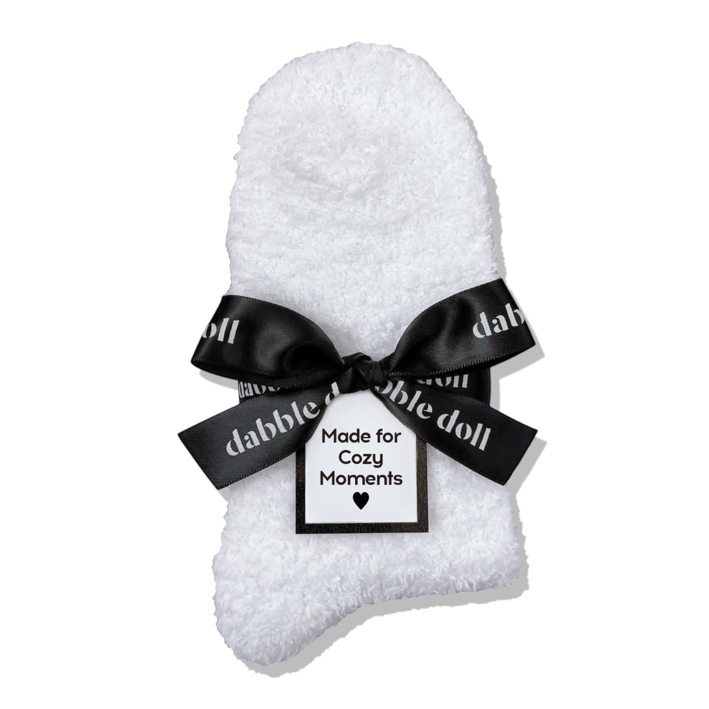 Dabble Doll Gift Box featuring cozy socks wrapped with a black bow for cozy moments