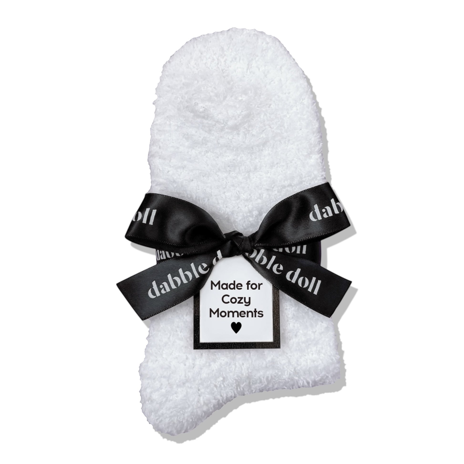 Dabble Doll Gift Box featuring cozy socks wrapped with a black bow for cozy moments