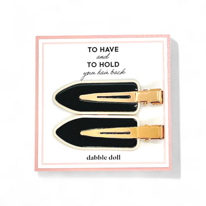 Dabble Doll black and gold crease free hair clips set on decorative card for holding hair back