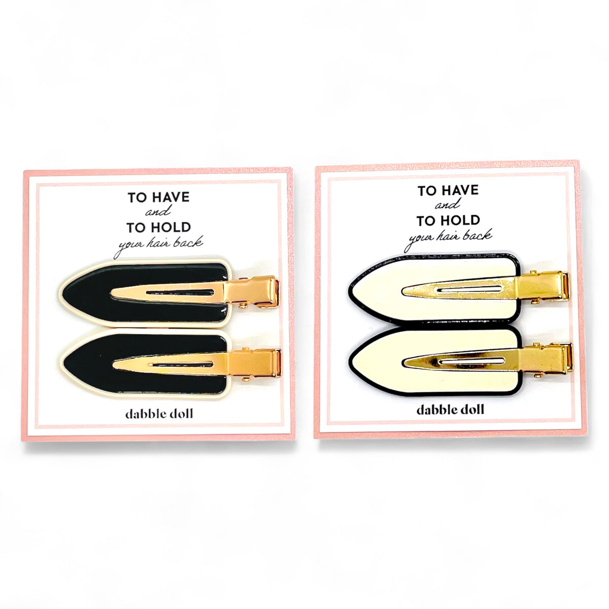 Dabble Doll crease free hair clips in black and white with gold accents for holding hair back