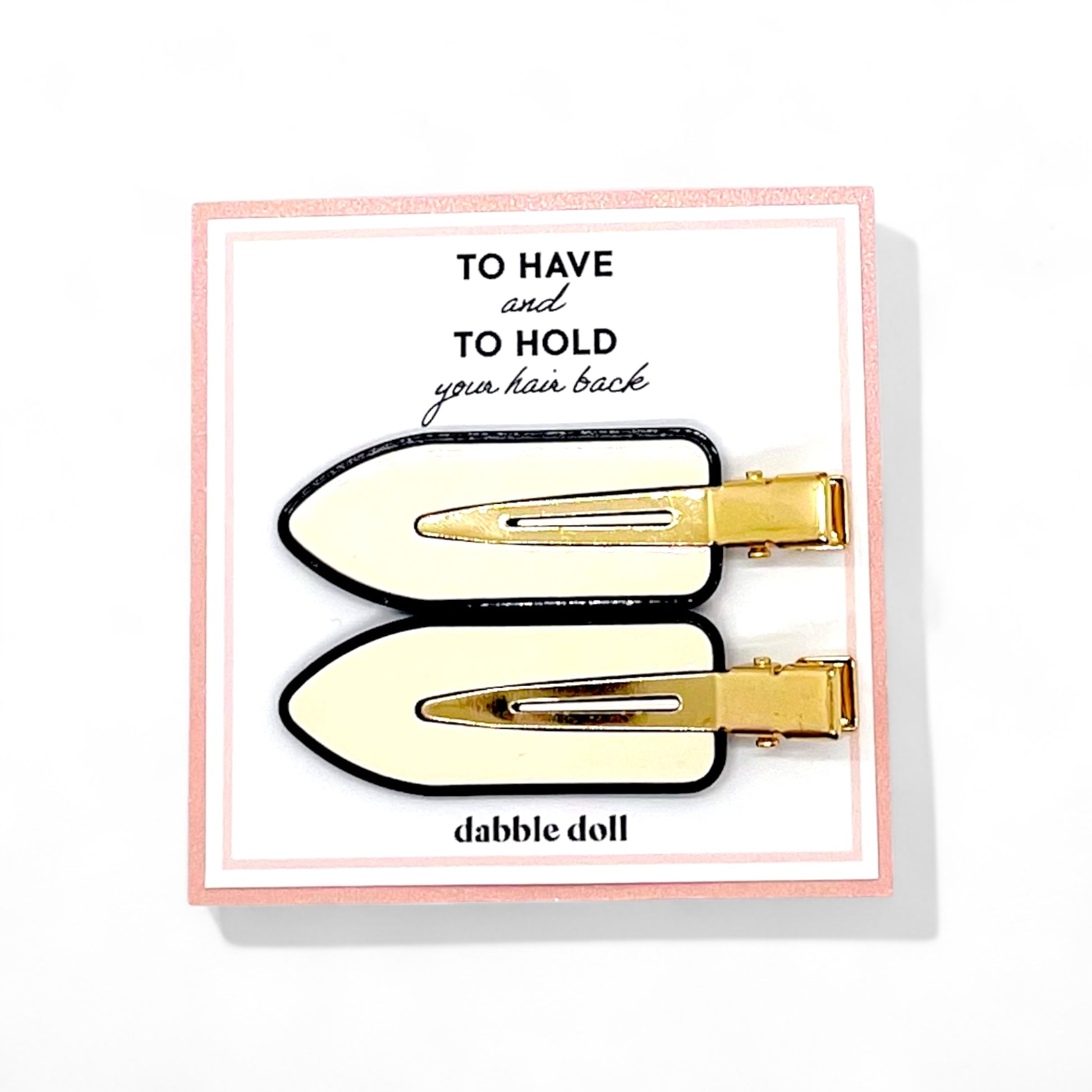 Dabble Doll crease free hair clips in cream and black with gold-tone metal for holding hair back