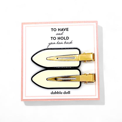 Dabble Doll crease free hair clips in cream and black with gold-tone metal for holding hair back
