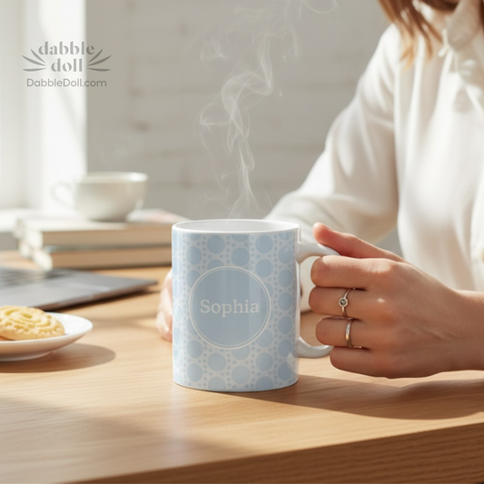 Personalized Dabble Doll Gift Box with custom name mug and cookies on a wooden table