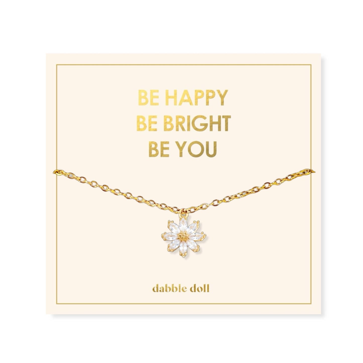 Dabble Doll Gift Box featuring a flower necklace with an elegant gold chain and floral pendant