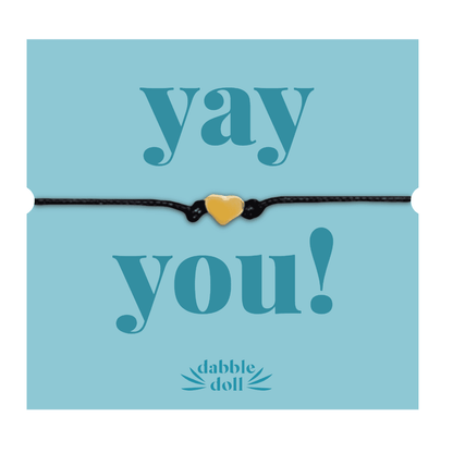 Dabble Doll Friendship Bracelet in Black with Yellow Heart Charm, perfect for girls and women