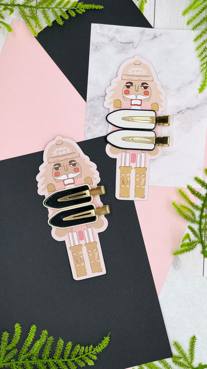 Dabble Doll gift box for girls featuring colorful hair clips in pastel tones and fun designs