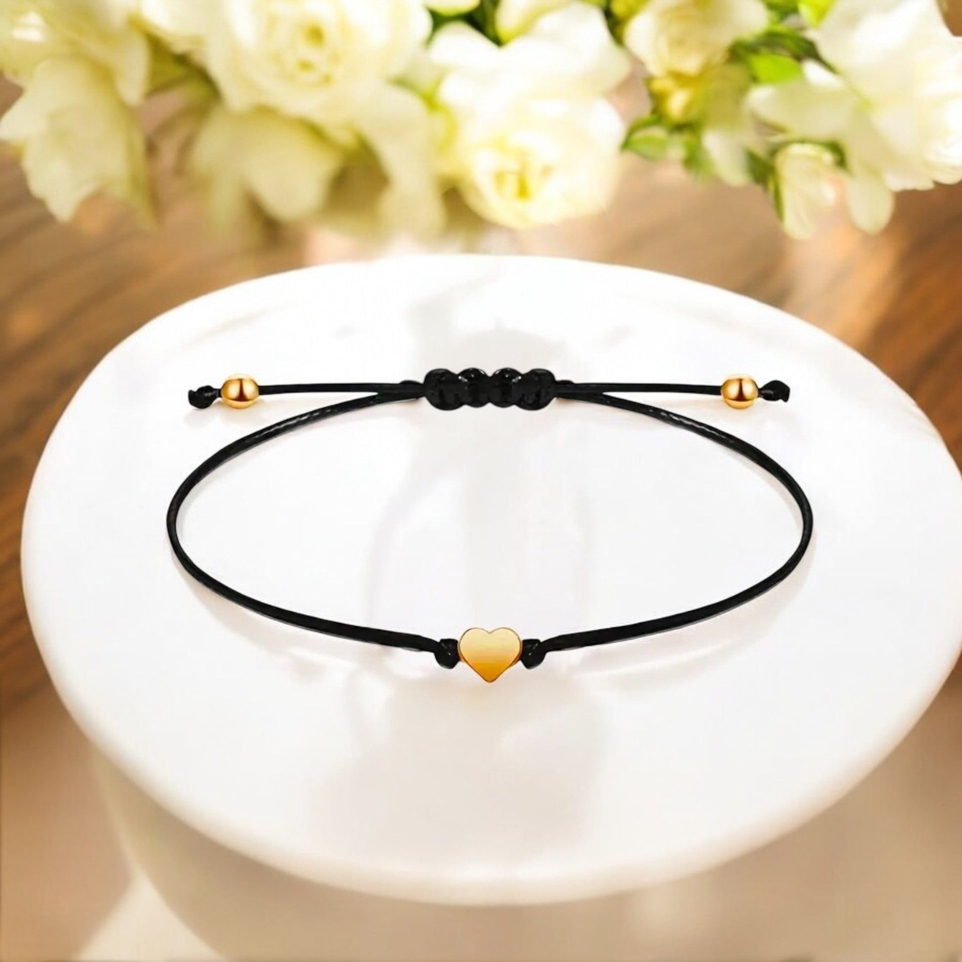 Charming black gift box from Dabble Doll with a heart bracelet, perfect for girls and women