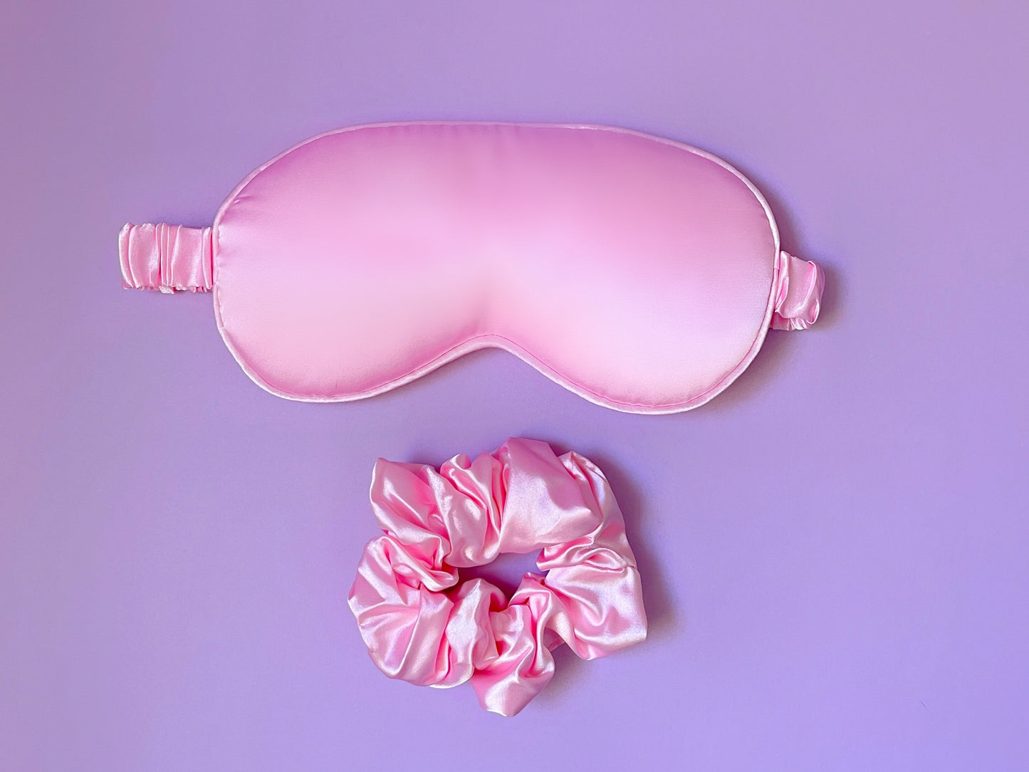 Dabble Doll pink silk gift box containing a sleep mask and matching scrunchie for girls and women