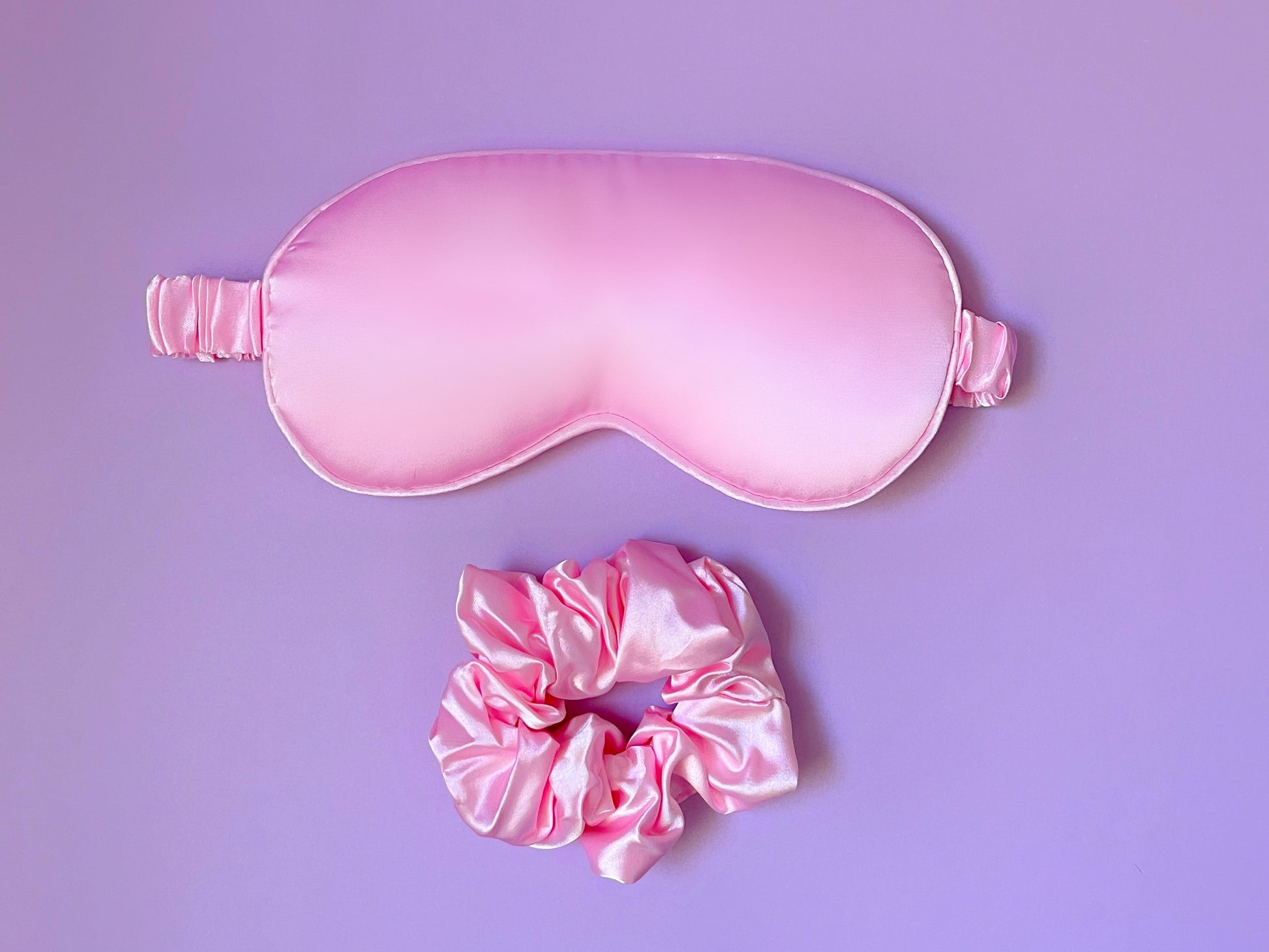Dabble Doll pink silk gift box containing a sleep mask and matching scrunchie for girls and women