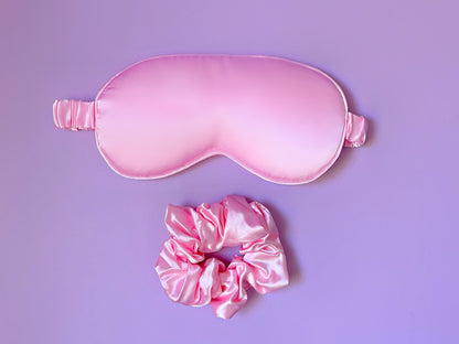 Dabble Doll pink silk gift box containing a sleep mask and matching scrunchie for girls and women