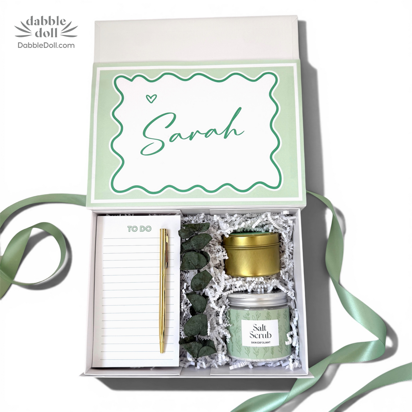 Personalized gift box from Dabble Doll with salt scrub, notepad, and pen for special occasions