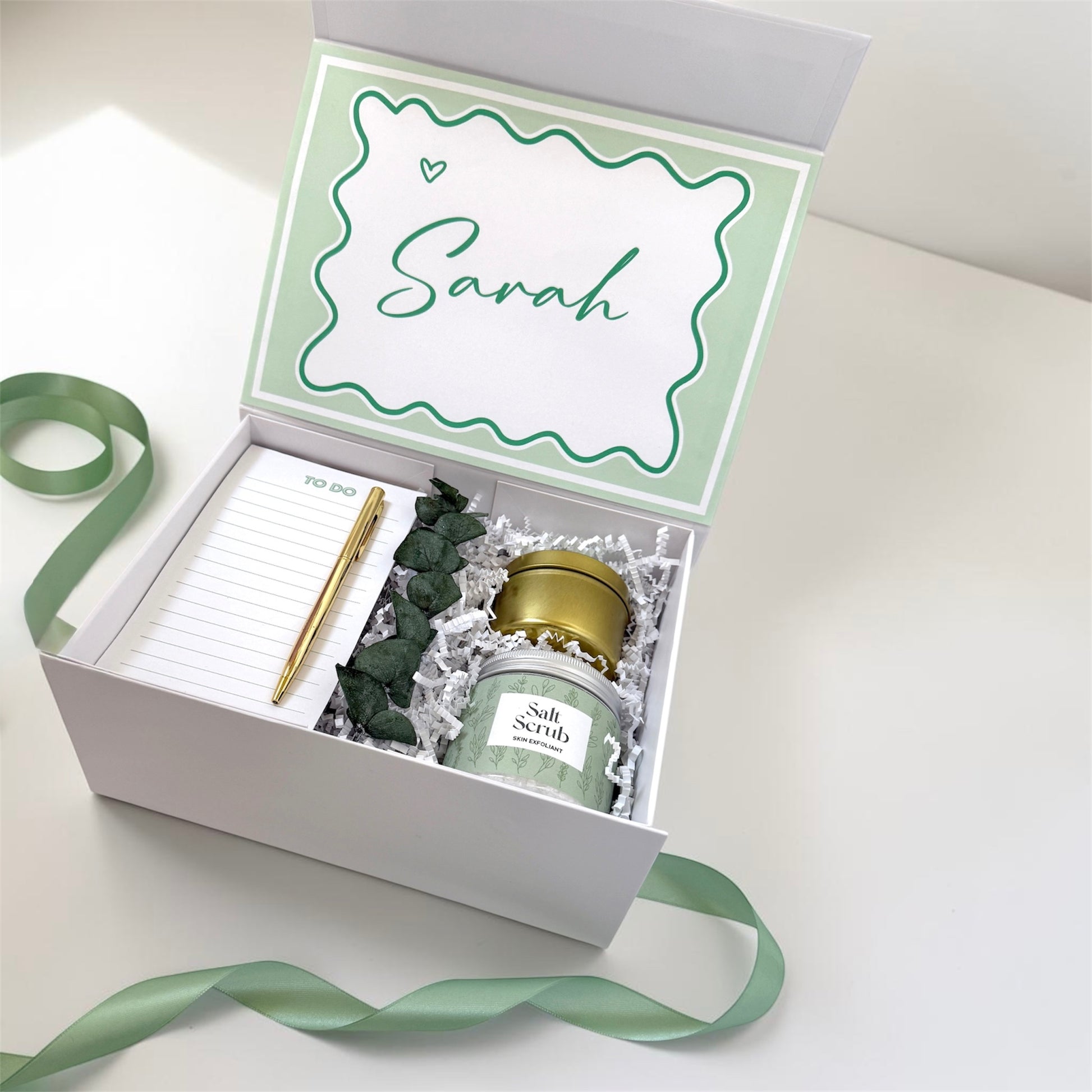 Dabble Doll personalized gift box filled with salt scrub, notepad, and decorative stones