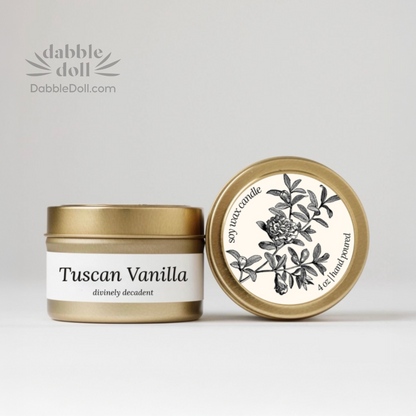 Dabble Doll gift box featuring a Tuscan Vanilla soy candle in a decorative tin