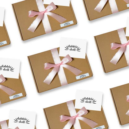 Dabble Doll Gift Boxes Wrapped in Pink Ribbon Perfect for Special Occasions