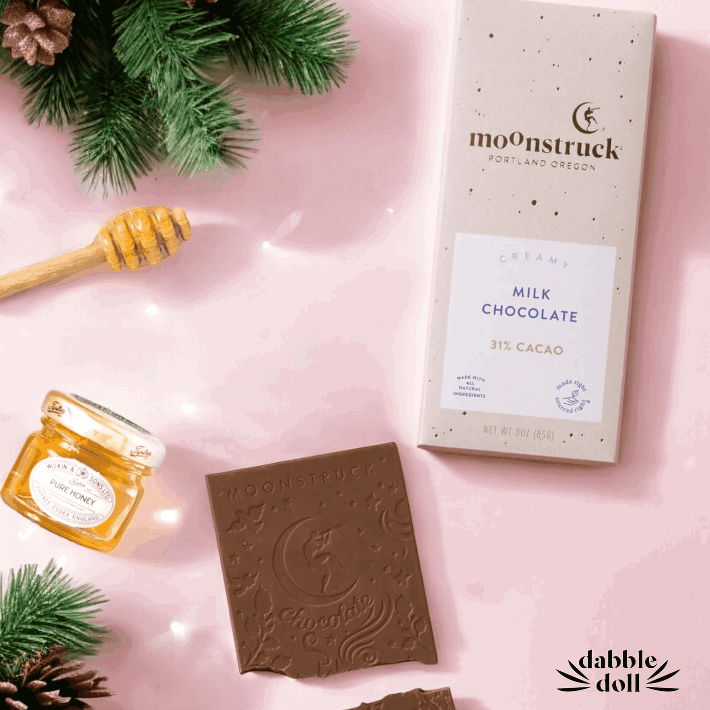 Gift in box featuring Moonstruck milk chocolate, honey, and festive greenery for special occasions