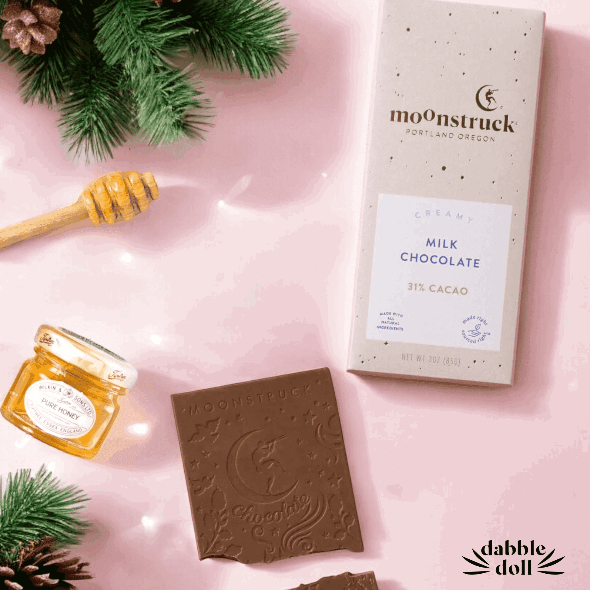 Gift in box featuring Moonstruck milk chocolate, honey, and festive greenery for special occasions
