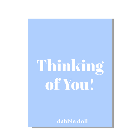 Light blue greeting card from Dabble Doll with 'Thinking of You!' for girls and women