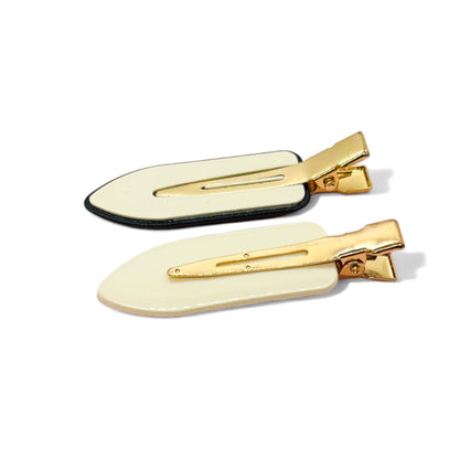 Elegant Dabble Doll hair clips in black and cream with gold accents, perfect for girls and women