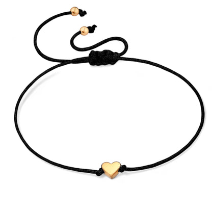 Black cord heart bracelet in gold for girls and women, perfect gift box accessory from Dabble Doll