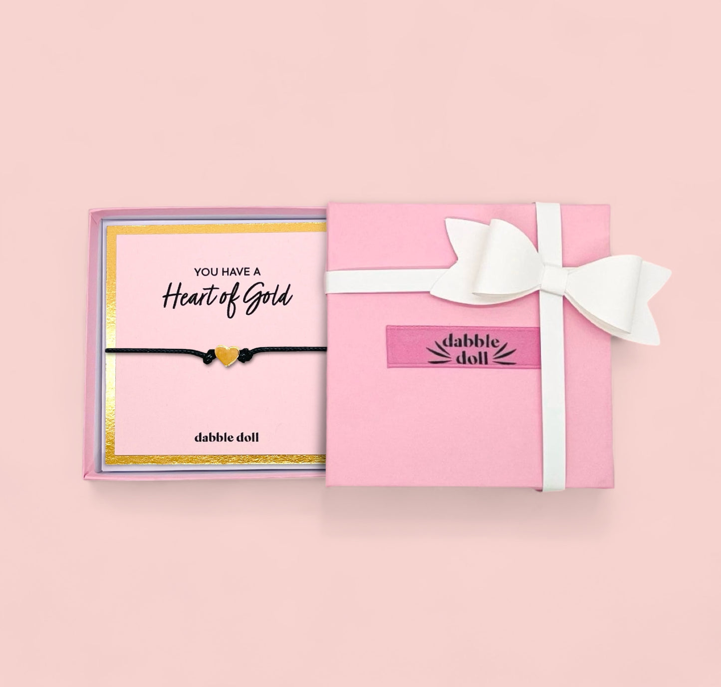 Gift box by Dabble Doll featuring a heart bracelet in black for girls and women, perfect for special occasions