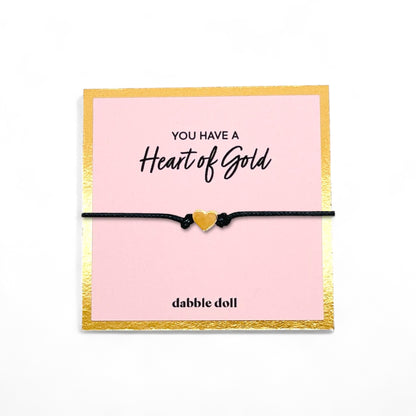 Heart bracelet in vibrant yellow on a black cord, ideal gift for girls and women from Dabble Doll
